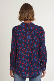 Model Riina wearing size 10 of the Cherry Delight Shirt in colour Navyred (Blue), from the back