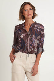 Model Riina wearing size 10 of the Montana Print Shirt in colour Coffee, from the front, cropped image