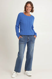 Model Riina wearing size S of the Hampton Cable Knit Jumper in colour Cobalt (Blue), from the front, showing the whole outfit