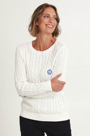 Model Riina wearing size S of the Hampton Cable Knit Jumper in colour Ivory (White), from the front, cropped image