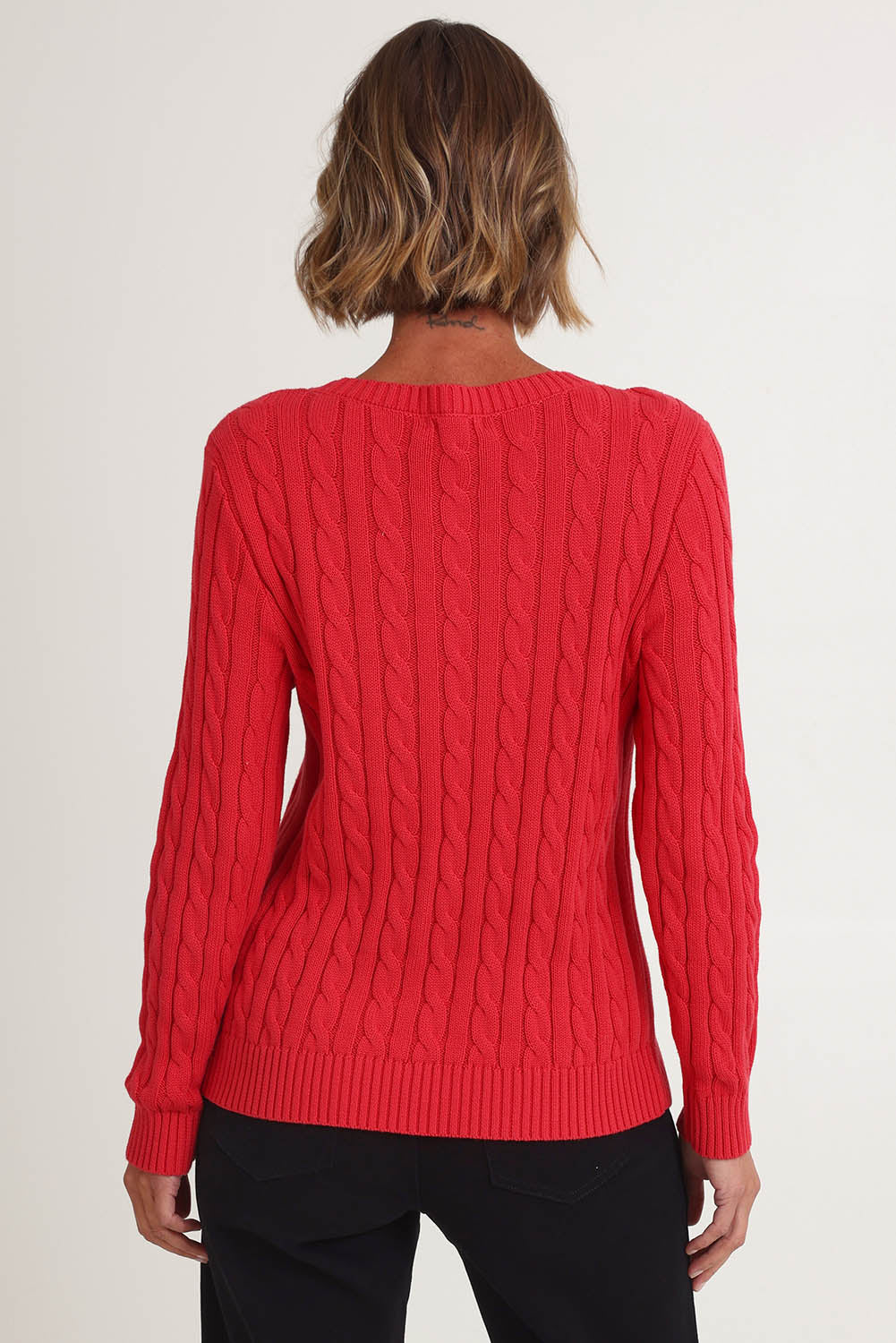 Model Riina wearing size S of the Hampton Cable Knit Jumper in colour Red (Red), from the back