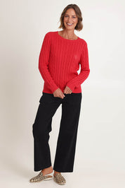 Model Riina wearing size S of the Hampton Cable Knit Jumper in colour Red (Red), from the front, showing the whole outfit