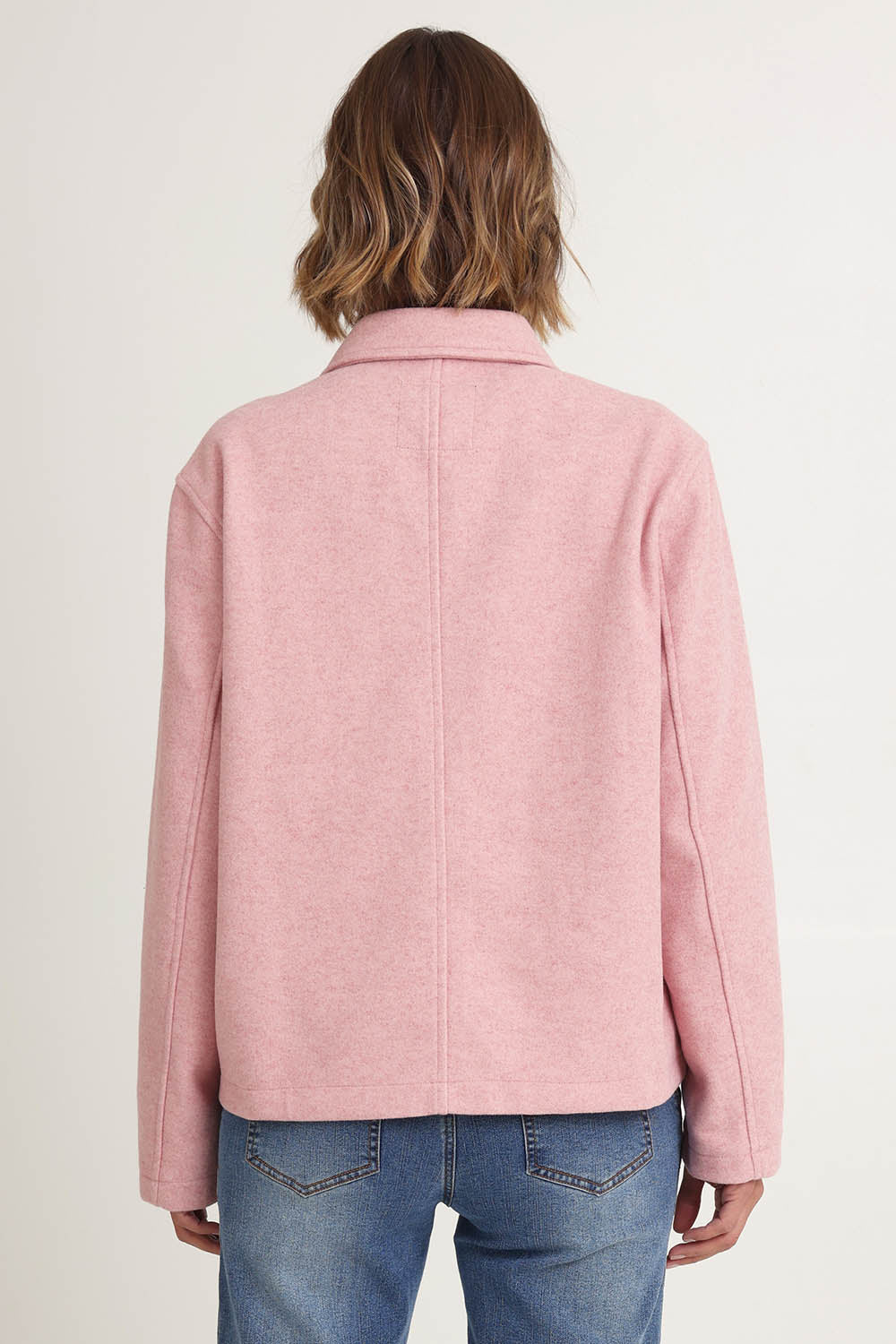 Model Riina wearing size 10 of the Montana Car Coat in colour Blush (Pink), from the back