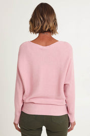 Model Riina wearing size S of the Billie Ribbed Knit in colour Blush (Pink), from the back