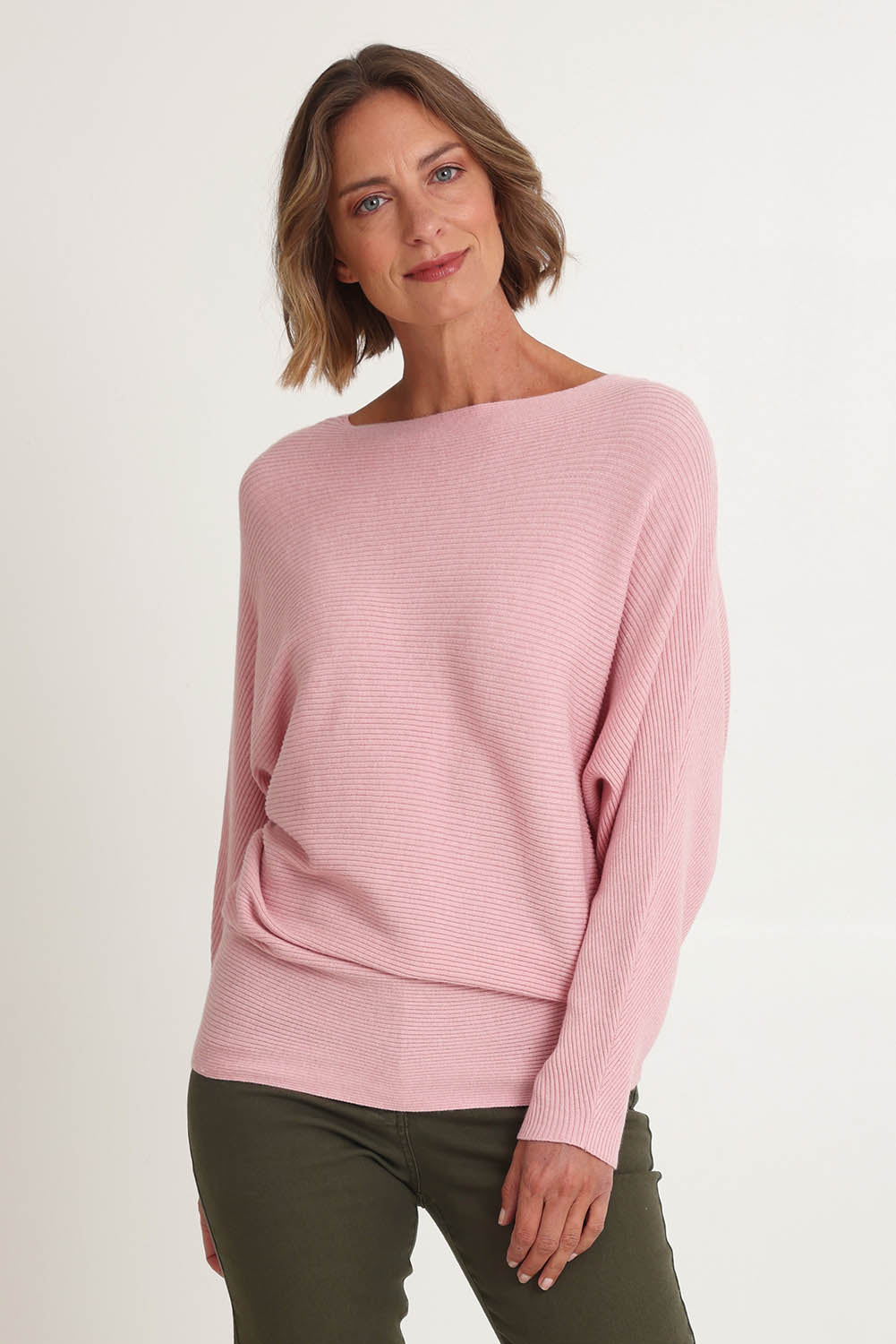 Model Riina wearing size S of the Billie Ribbed Knit in colour Blush (Pink), from the front, cropped image