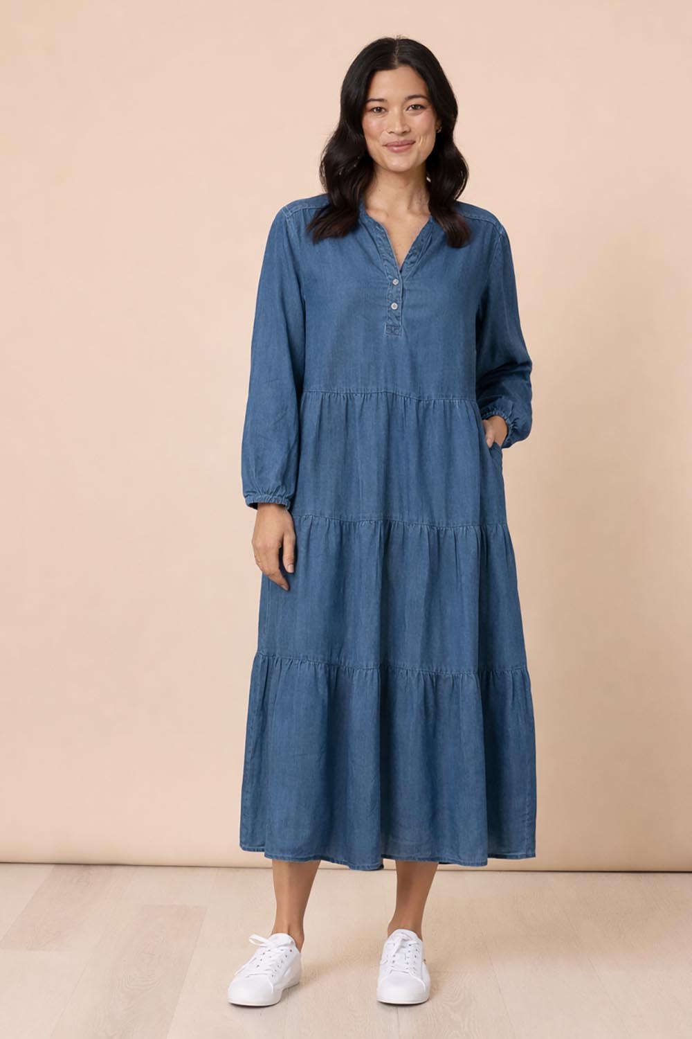 A model wearing the Macy Lyocell Dress in colour Denim (Blue), from the front, showing the whole outfit