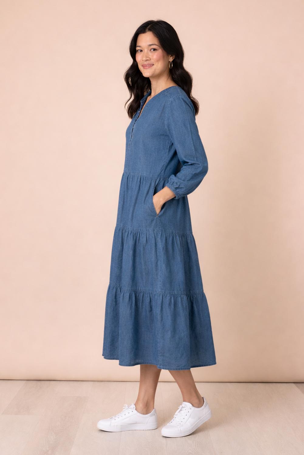 A model wearing the Macy Lyocell Dress in colour Denim (Blue), from the front, showing the whole outfit