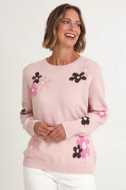 Model Riina wearing size S of the Chelsea Flower Knit in colour Blush (Pink), from the front, cropped image