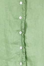 Product shot of the Audrey Ruffle Linen Top - Fern in colour Fern, showing detail