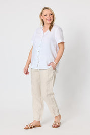 Model Genericm wearing size sample of the Audrey Ruffle Linen Top - White in colour White, from the front