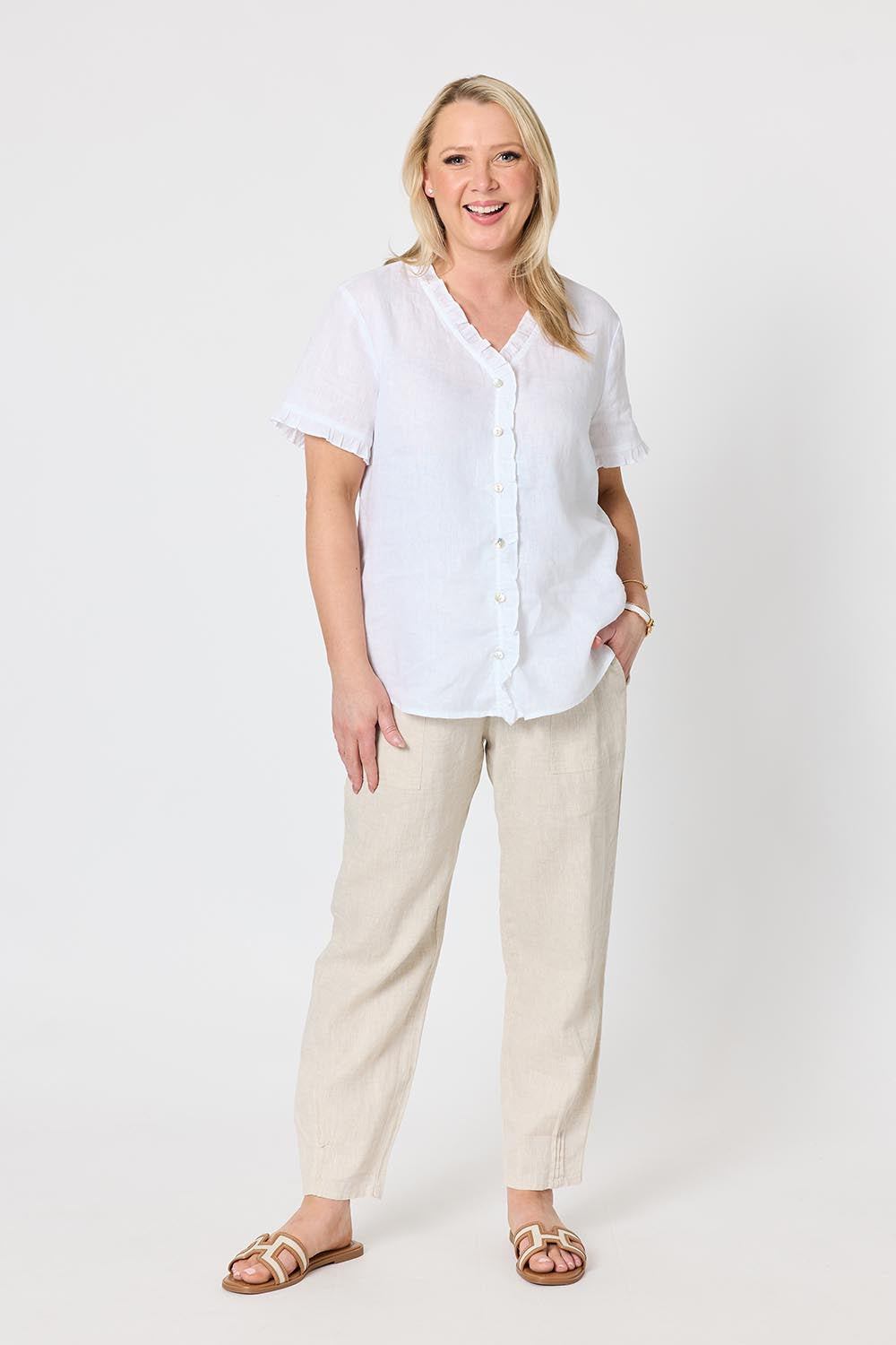 Model Genericm wearing size sample of the Audrey Ruffle Linen Top - White in colour White, from the front