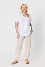 Model Genericm wearing size sample of the Audrey Ruffle Linen Top - White in colour White, from the front