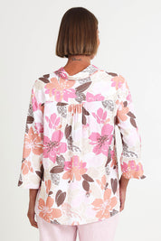 Model Riinar wearing size 10 of the Amalfi Rose Print Shirt – Pinkmulti in colour Pinkmulti, from the back