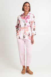 Model Riinar wearing size 10 of the Amalfi Rose Print Shirt – Pinkmulti in colour Pinkmulti, from the front