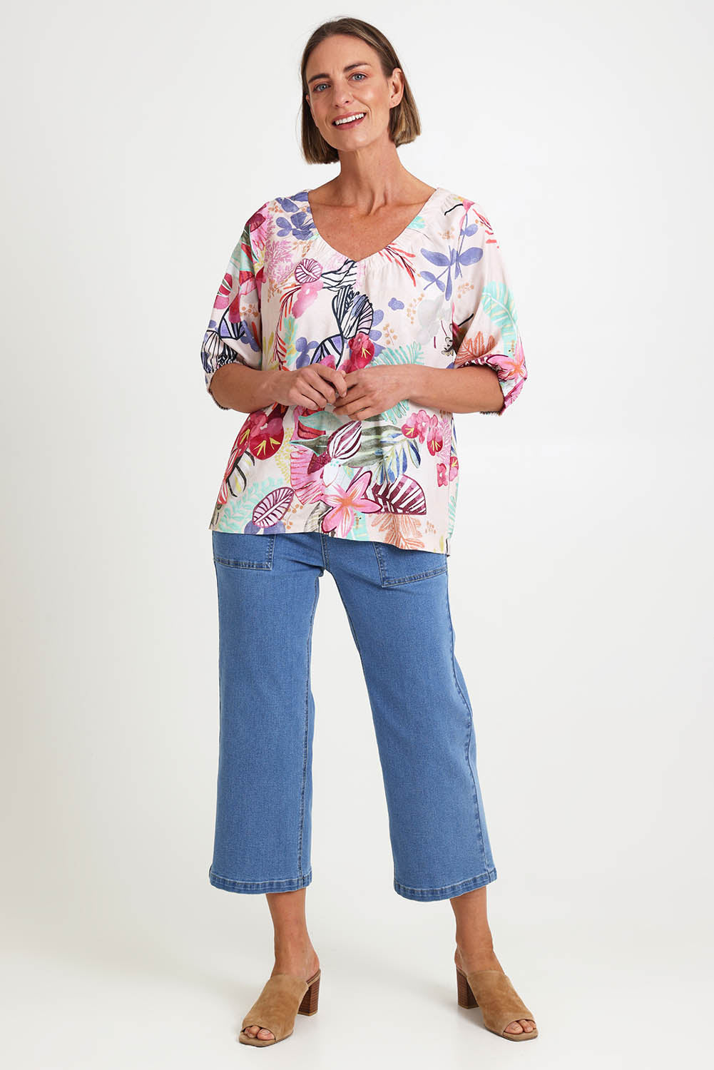 Model Riinar wearing size 10 of the Desert Rose Print Top – Pinkmulti in colour Pinkmulti, from the front