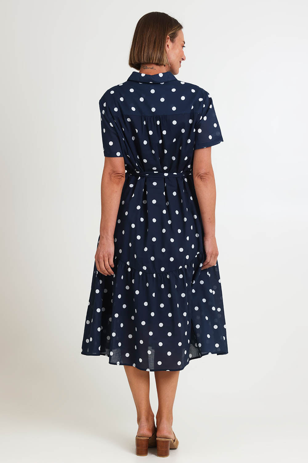 Model Riinar wearing size 10 of the Riviera Spot Dress – Navywhite in colour Navywhite, from the front