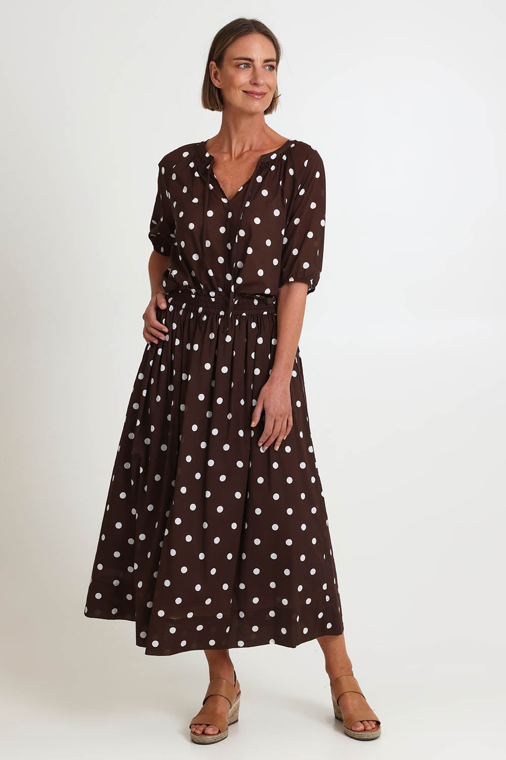 Model Riinar wearing size 10 of the Riviera Spot Top – Coffee in colour Coffee, from the front