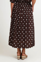 Model Riinar wearing size 10 of the Riviera Spot Skirt – Coffee in colour Coffee, from the back