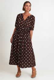 Model Riinar wearing size 10 of the Riviera Spot Skirt – Coffee in colour Coffee, from the front