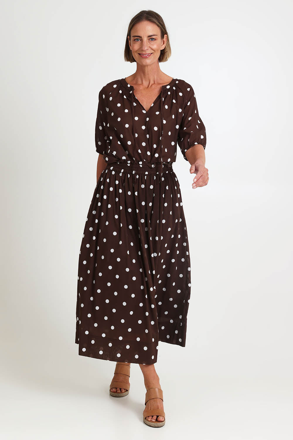Model Riinar wearing size 10 of the Riviera Spot Skirt – Coffee in colour Coffee, from the front