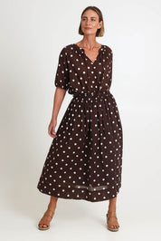 Model Riinar wearing size 10 of the Riviera Spot Skirt – Coffee in colour Coffee, from the front