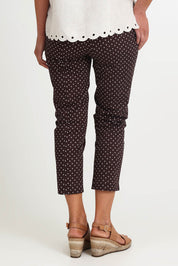 Model Riinar wearing size 10 of the Shell Print Pant – Mocha in colour Mocha, from the back
