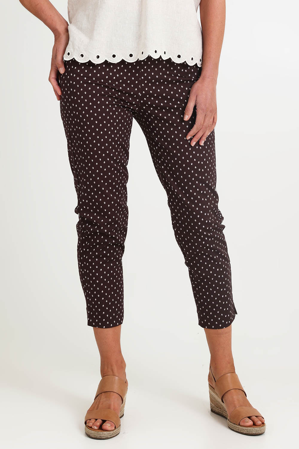 Model Riinar wearing size 10 of the Shell Print Pant – Mocha in colour Mocha, in a cropped view