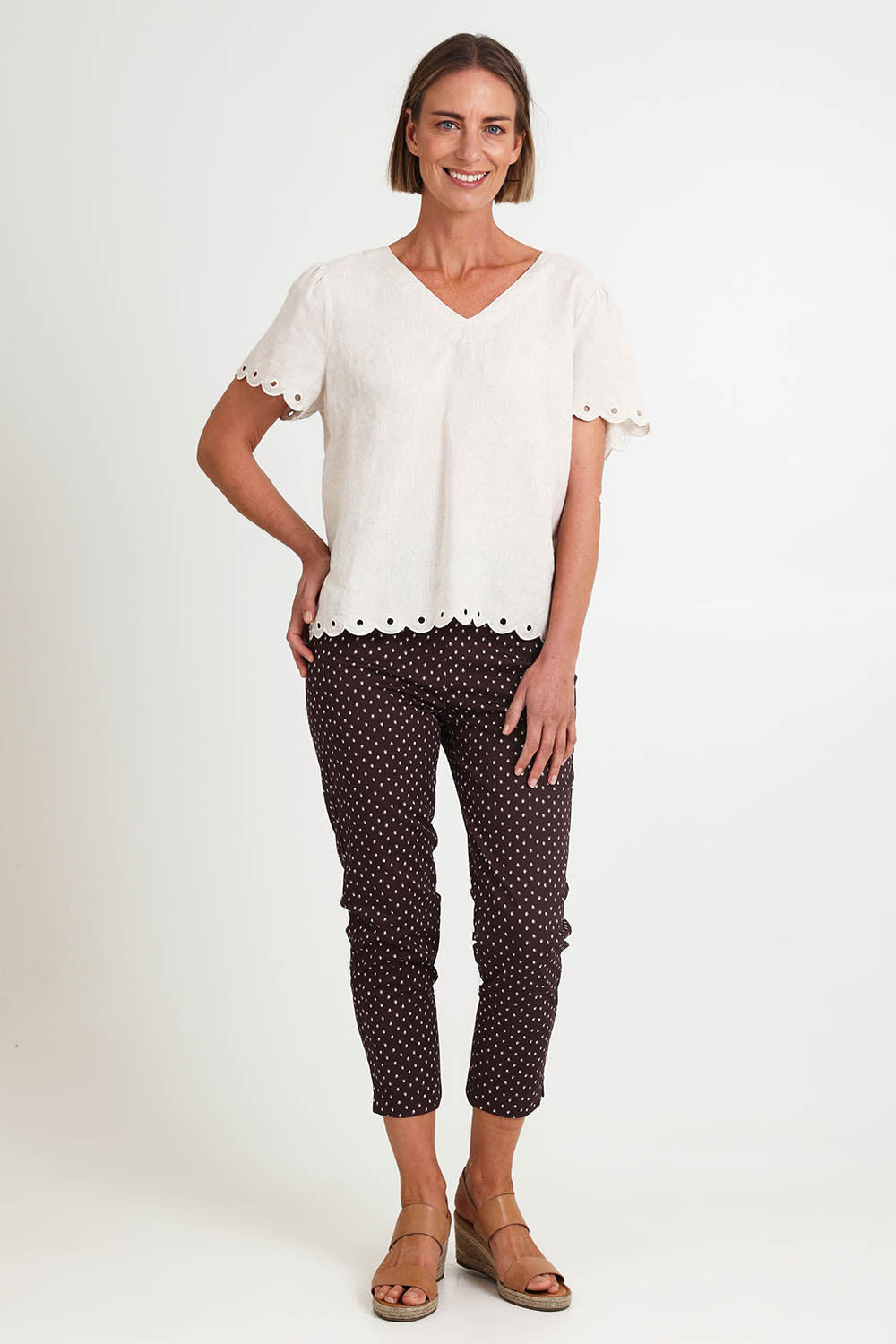 Model Riinar wearing size 10 of the Shell Print Pant – Mocha in colour Mocha, from the front