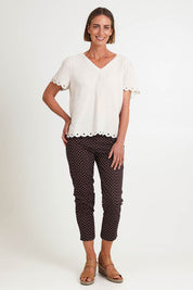 Model Riinar wearing size 10 of the Shell Print Pant – Mocha in colour Mocha, from the front