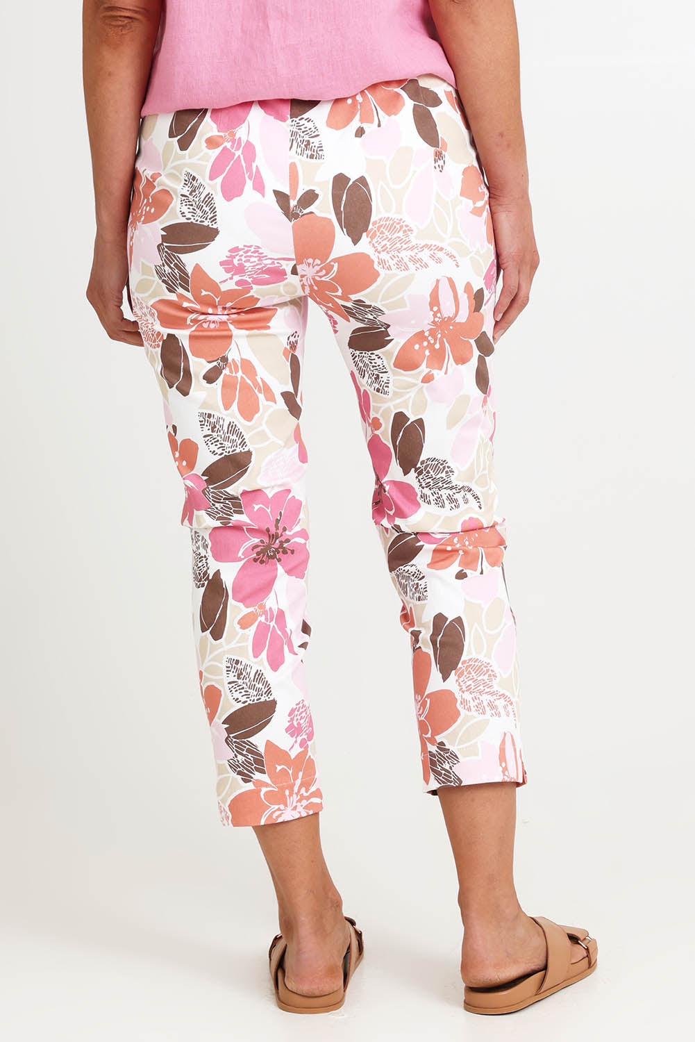 Model Riinar wearing size 10 of the Amalfi Rose Print Pant – Pinkmulti in colour Pinkmulti, from the back