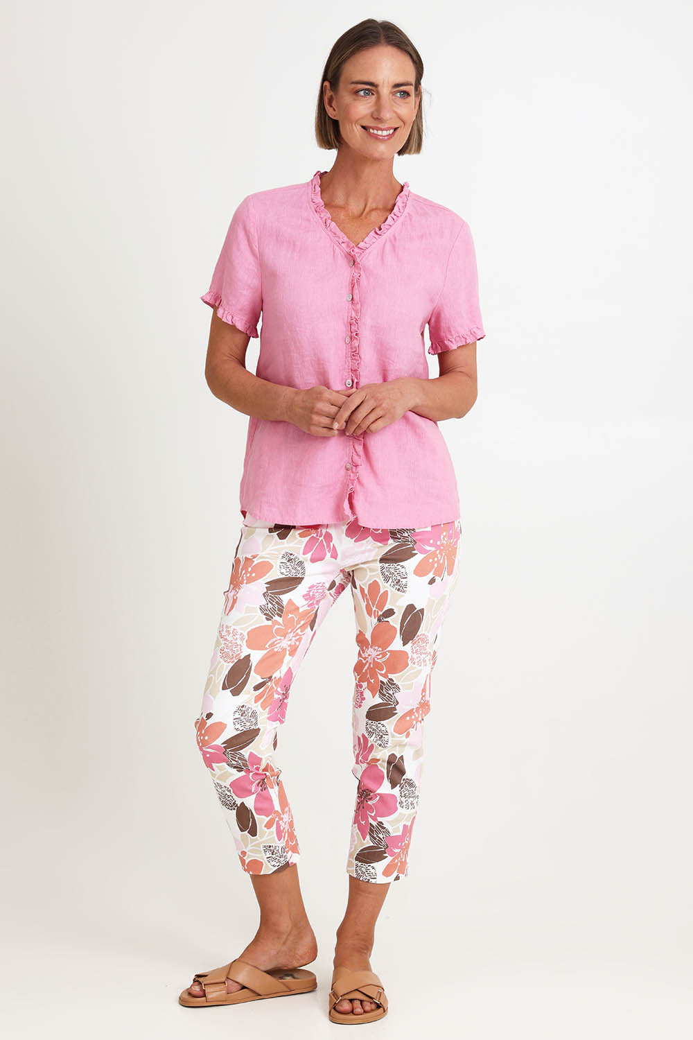 Model Riinar wearing size 10 of the Amalfi Rose Print Pant – Pinkmulti in colour Pinkmulti, from the front