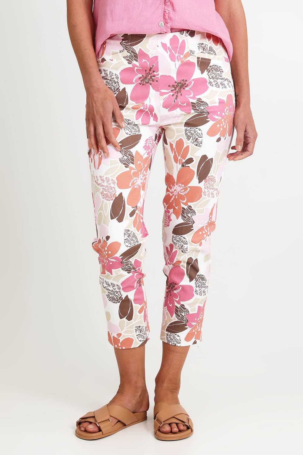 Model Riinar wearing size 10 of the Amalfi Rose Print Pant – Pinkmulti in colour Pinkmulti, from the front