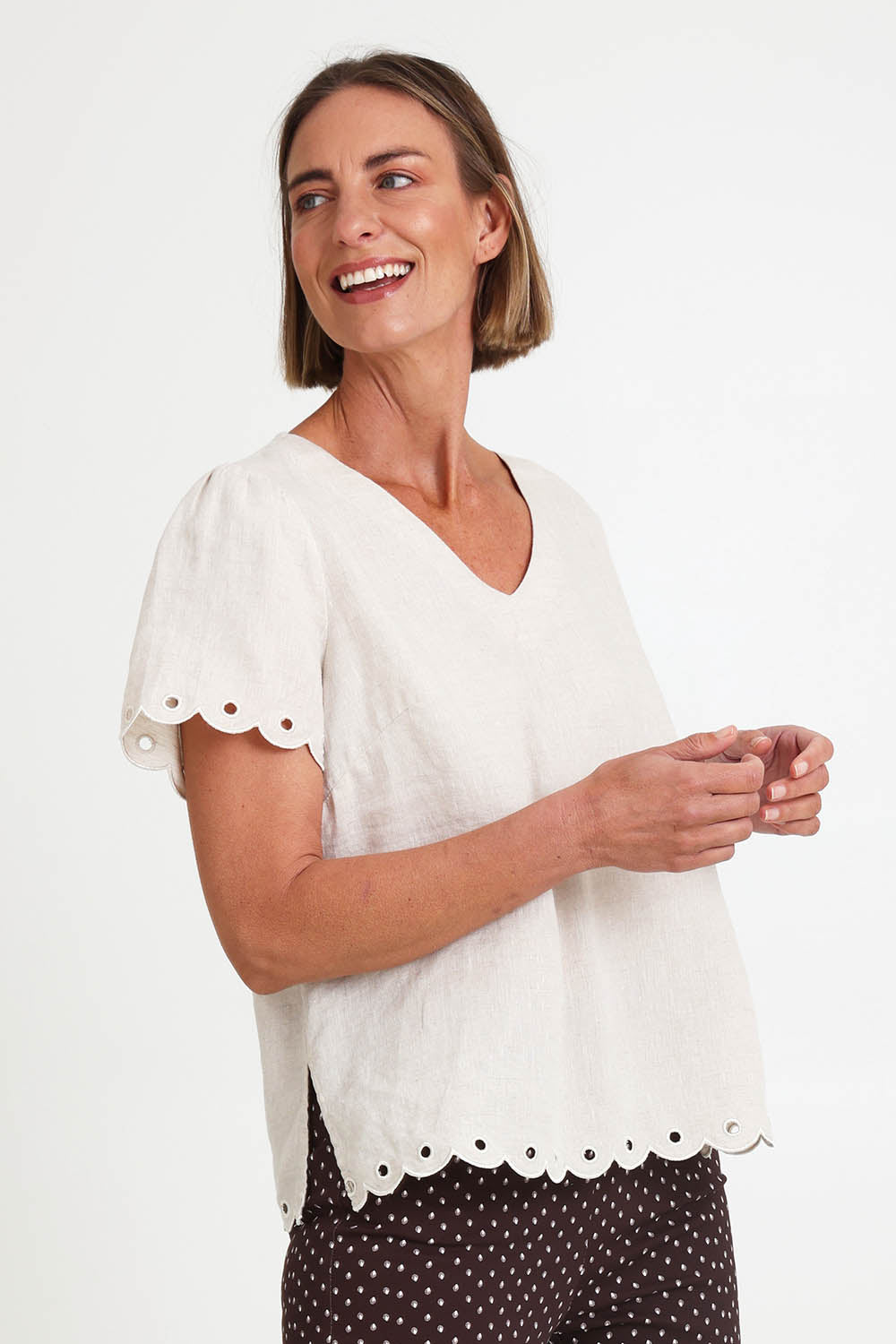 Model Riinar wearing size 10 of the Lilly Linen Top – Natural in colour Natural, in a cropped view