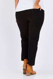 Model Mae wearing size 18 of the Slim Miracle Denim Jeans in colour Black (Black), from the back