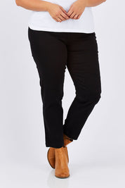 Model Mae wearing size 18 of the Slim Miracle Denim Jeans in colour Black (Black), from the front, cropped image