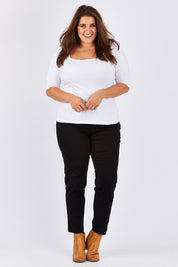Model Mae wearing size 18 of the Slim Miracle Denim Jeans in colour Black (Black), from the front, showing the whole outfit