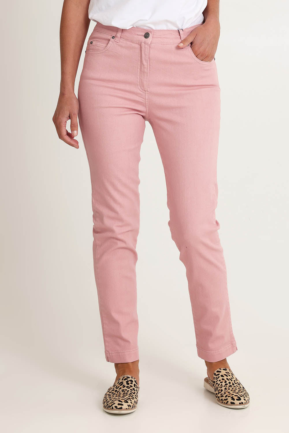 Model Riina wearing size 10 of the Slim Miracle Denim Jeans in colour Blush (Pink), from the front, cropped image
