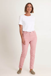 Model Riina wearing size 10 of the Slim Miracle Denim Jeans in colour Blush (Pink), from the front, showing the whole outfit