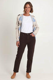 Model Riina wearing size 10 of the Slim Miracle Denim Jeans in colour Coffee, from the front, showing the whole outfit