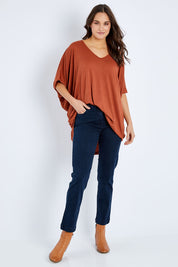 Model Elhana wearing size 10 of the Slim Miracle Denim Jeans in colour Denim (Blue), from the front, showing the whole outfit