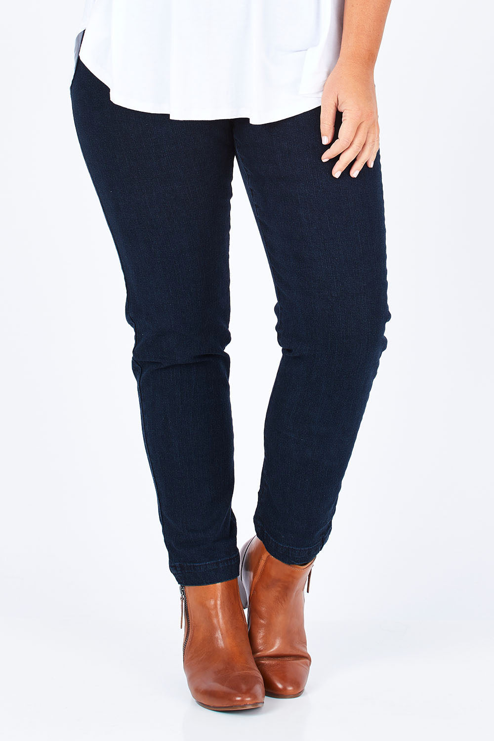 Model Fiona wearing size 16 of the Slim Miracle Denim Jeans in colour Denim (Blue), from the front, cropped image