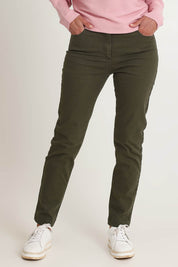 Model Riina wearing size 10 of the Slim Miracle Denim Jeans in colour Khaki (Green), from the front, cropped image