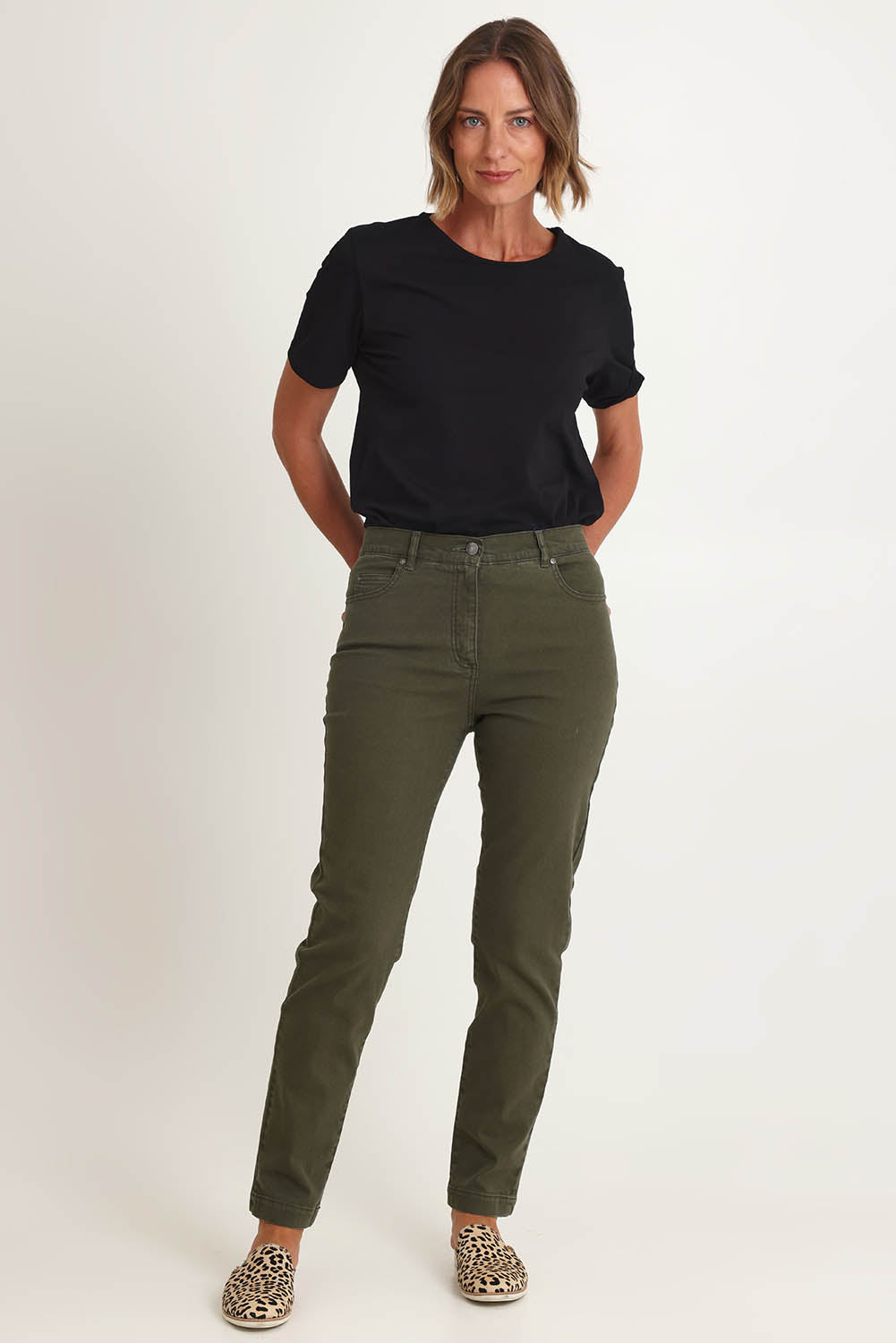 Model Riina wearing size 10 of the Slim Miracle Denim Jeans in colour Khaki (Green), from the front, showing the whole outfit