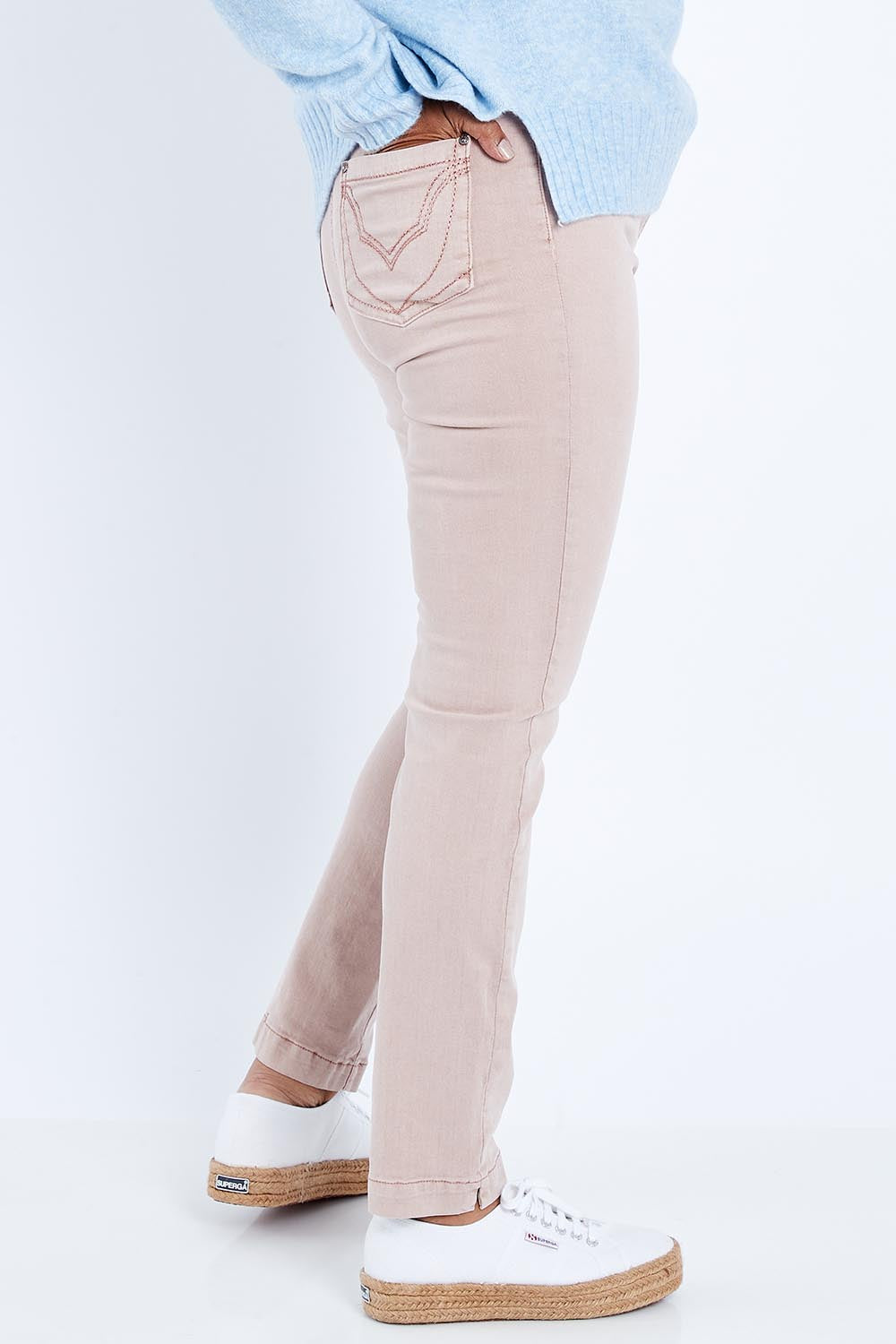 Model Nadine wearing size 10 of the Slim Miracle Denim Jeans in colour Muskpink (Pink), from the front, cropped image