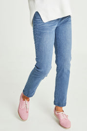 Model Emma wearing size 10 of the Slim Miracle Denim Jeans in colour Washdenim (Blue), from the front, cropped image