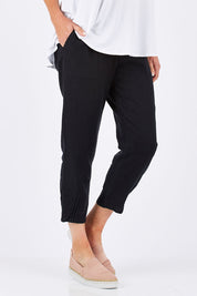 Model Louise wearing size 10 of the Pull On Linen Pant in colour Black (Black), from the front, cropped image