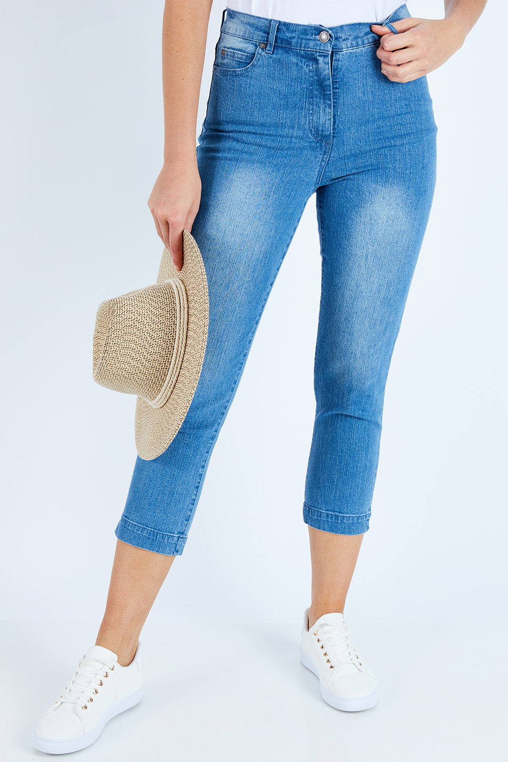 Model Madeline wearing size 10 of the Cropped Miracle Jean in colour Bleached (Blue), from the front, cropped image