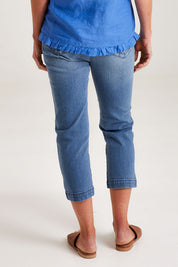 Model Emma wearing size 10 of the Cropped Miracle Jean in colour Washdenim (Blue), from the back