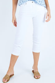 Model Madeline wearing size 10 of the Cropped Miracle Jean in colour White (White), from the front, cropped image
