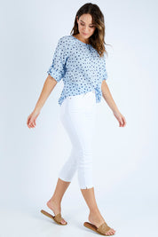 Model Madeline wearing size 10 of the Cropped Miracle Jean in colour White (White), from the front, showing the whole outfit